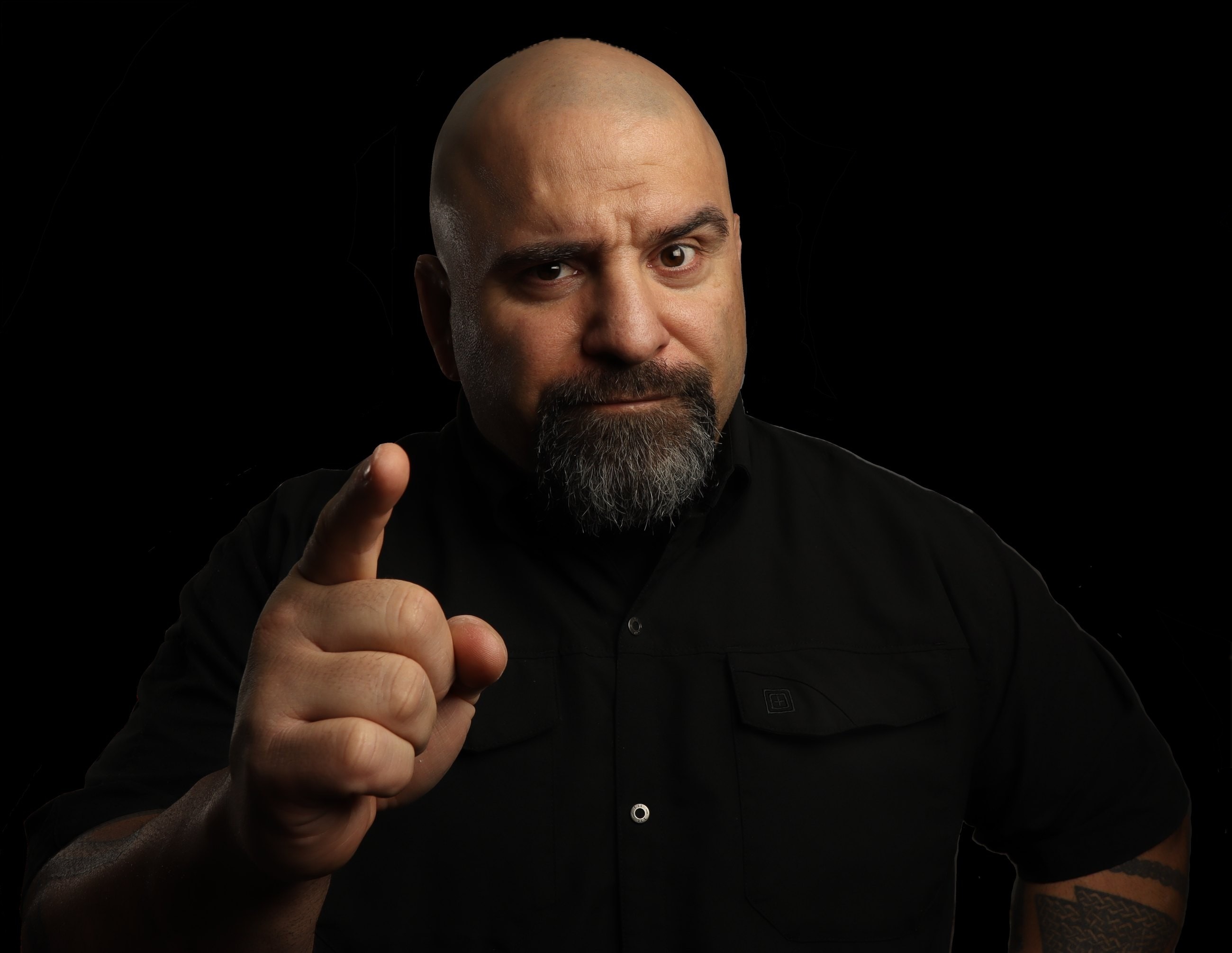 Master Chim pointing at the camera