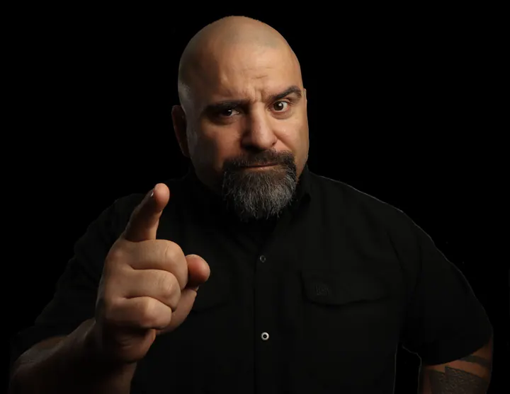 Master Chim pointing at the camera