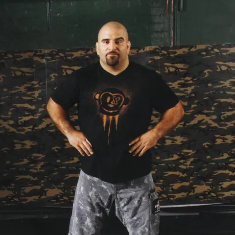 Master Chim standing in his academy